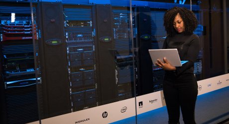 Woman working by cloud server